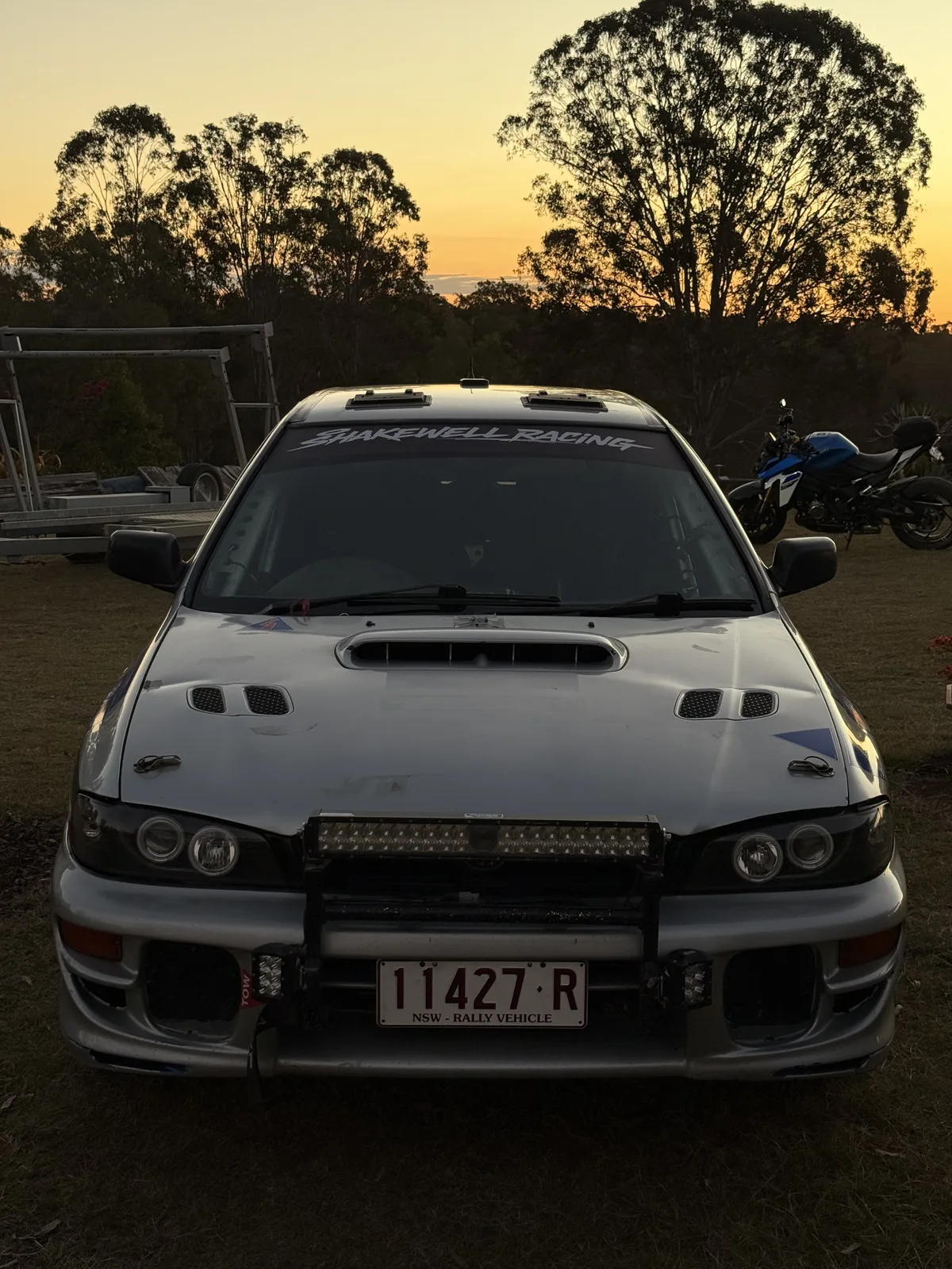 Shakewell Racing Subaru Impreza with its LED light bar at dusk before the night stages of the Classic Queensland Rally 2026