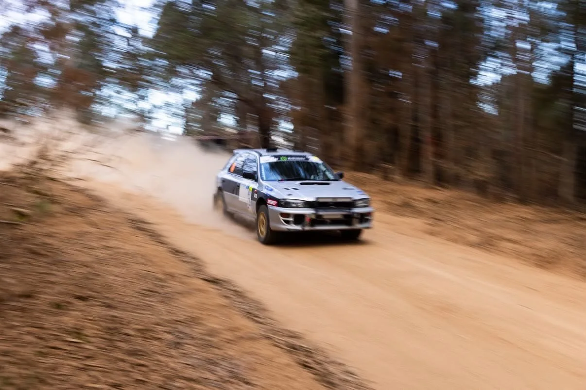 Shakewell Racing Subaru Impreza kicking up dust on a forest gravel stage at the Narooma Forest Rally 2026